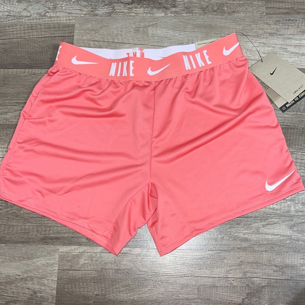 Nike Dri-fit. Standard fit. Coral pink.